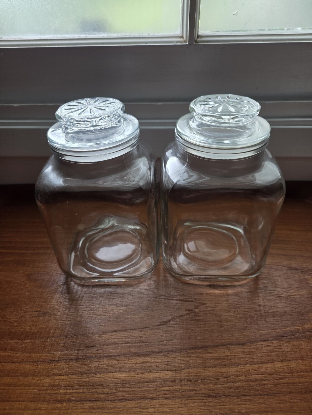 Set of two vintage square clear glass storage jars, starburst-pattern glass Lids